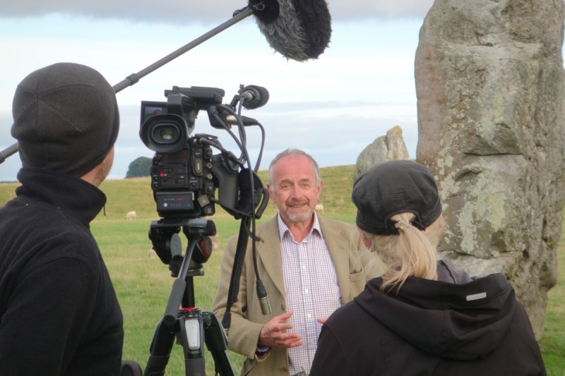 Timothy Darvill in front of the cameras at Avebury